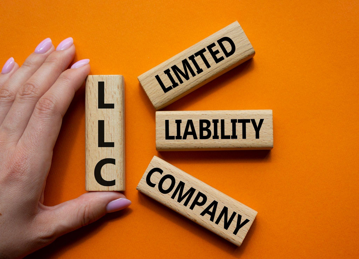 wooden cubes with the word llc